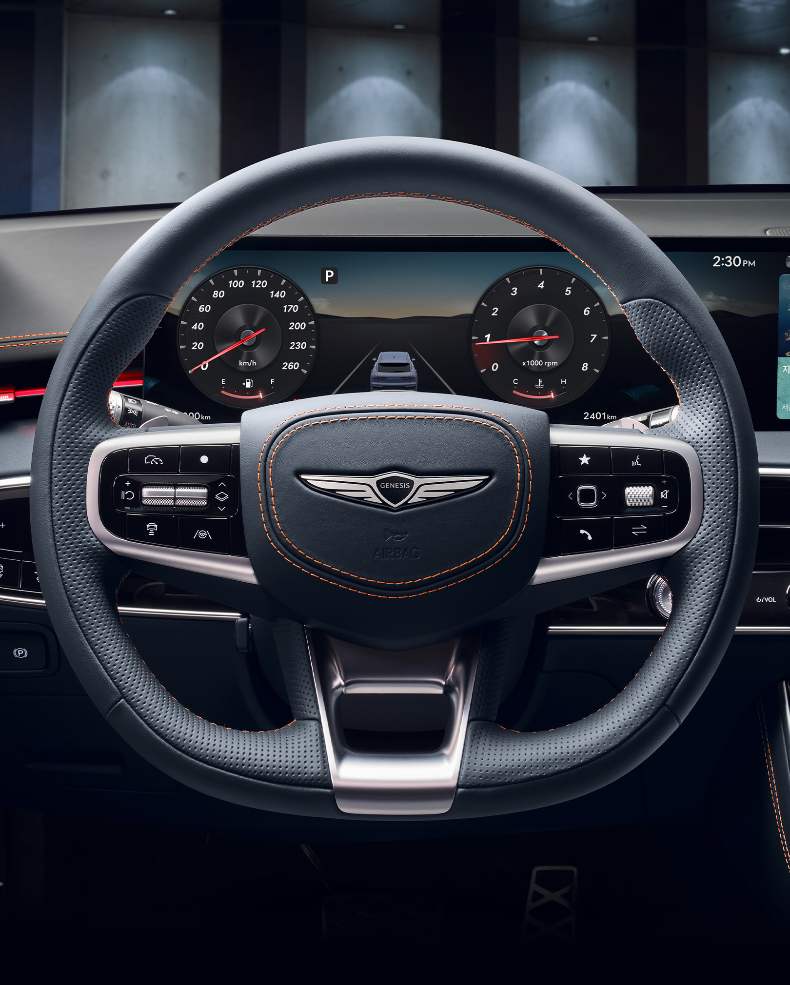 You can see the black leather D-cut steering wheel and the instrument cluster inside the wide display.